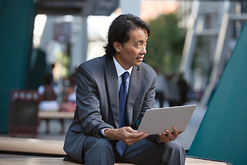 Image showing Businessman with laptop