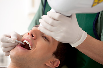 Image showing Dentist Preparing X-Ray