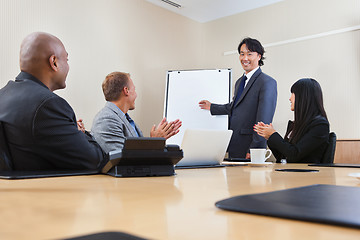 Image showing Man giving a presentation to associates