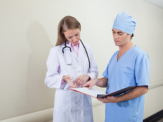 Image showing Doctor and nurse studying information