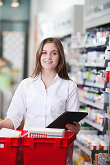 Image showing Female Pharmacist Holding Tablet PC