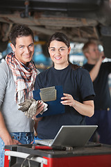 Image showing Female mechanic with customer