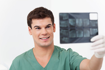 Image showing Dentist holding X-Ray