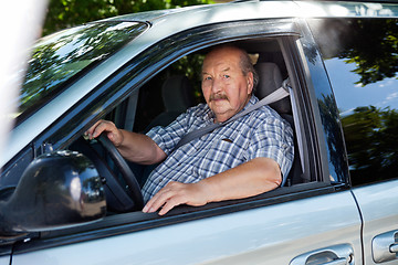 Image showing Senior man driving a car