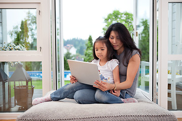 Image showing Mother and daughter with laptop