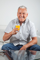 Image showing Senior Man Having Fresh Orange Juice