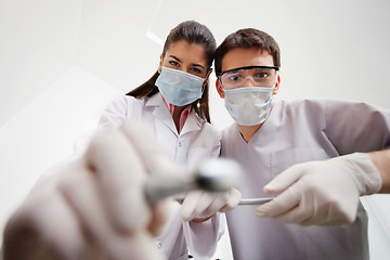 Image showing Dentist and technician with dental tools