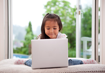 Image showing Cute Child Using Laptop Computer