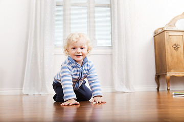 Image showing Child Crawling on Floor