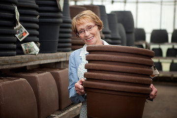 Image showing Senior With Plant Pots