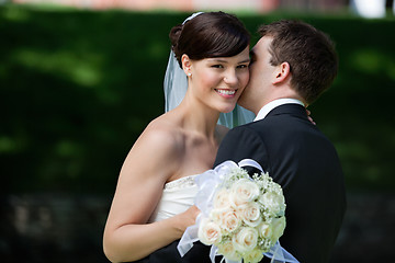 Image showing Man Kissing Wife on Cheeks