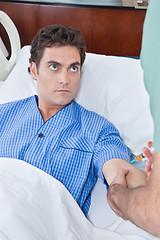 Image showing Patient staring doctor