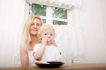 Image showing Mother and Son Eating Meal