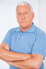 Image showing Serious Senior Man With Arms Crossed