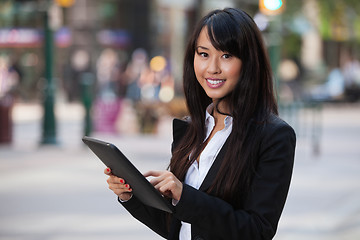 Image showing Portrait of businesswoman using tablet pc