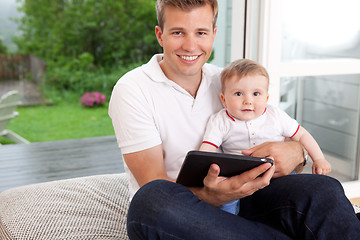 Image showing Father and Son with Digital Tablet