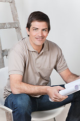 Image showing Man holding with blueprint