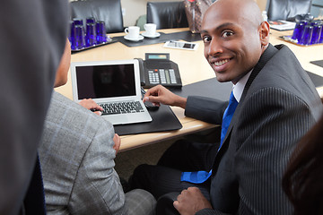 Image showing Business people using laptop in office