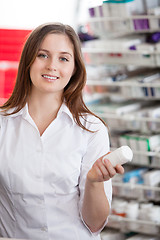 Image showing Female Chemist Holding Medication Container