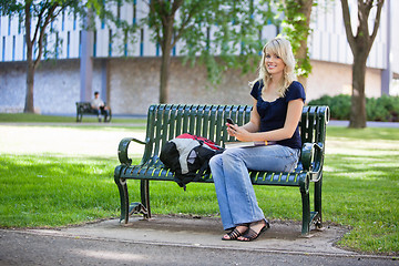 Image showing Young girl holding cell phone