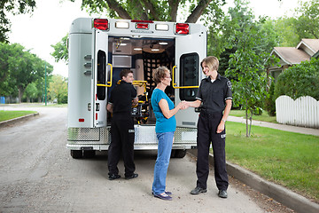 Image showing Elderly Woman with Ambulance Staff