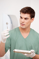 Image showing Dentist Inspecting Mirror