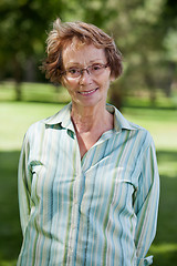 Image showing Happy senior woman standing in park