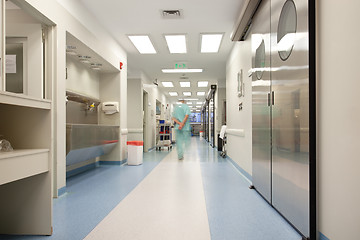 Image showing Doctor walking through hospital corridor