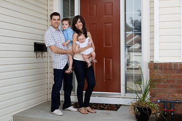 Image showing Young Coupld Outside House with Kids