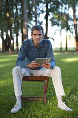 Image showing Casual Man Holding Tablet PC