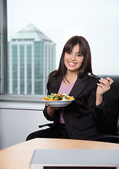 Image showing Woman Having Fresh Salad of Vegetables