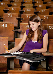 Image showing Happy Student Taking Notes