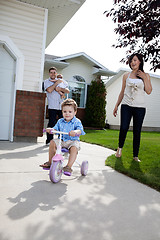 Image showing Little Boy Learning Tricycle