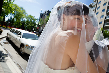 Image showing Man Kissing His Wife