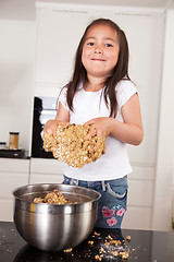 Image showing Little Girl Making Cookies