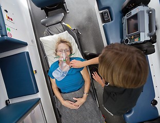 Image showing Ambulance Interior with Senior Patient and EMT