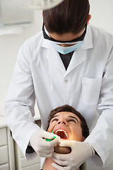 Image showing Patient having his teeth examined