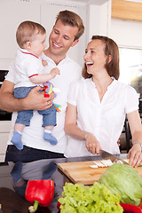 Image showing Family Laughing in Kitchen