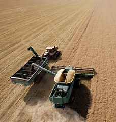 Image showing Combine and Grain Cart