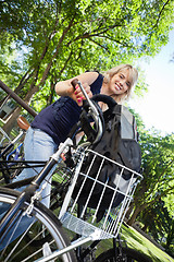 Image showing Attractive Female Student with Bike