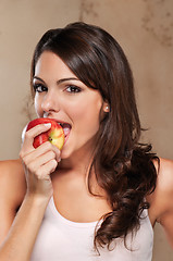 Image showing Close-up of woman eating an apple