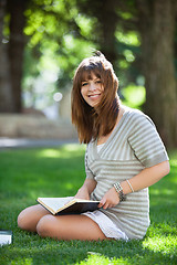 Image showing College student holding book