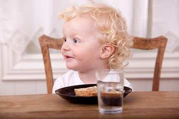 Image showing Young Boy Eating Lunch
