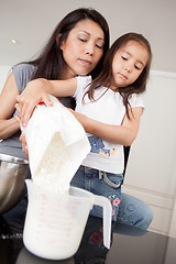 Image showing Mother and Daughter Measuring Ingredient