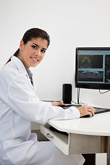 Image showing Female dentist working on computer