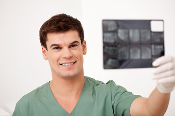 Image showing Dentist Looking at X-rays