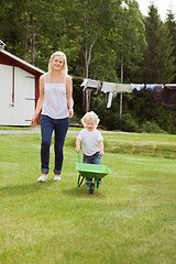 Image showing Mother and child in garden