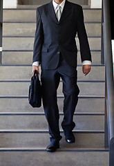 Image showing Businessman Walking Down Stairs