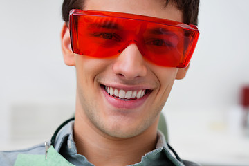 Image showing Handsome dentist wearing protective eyewear