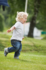 Image showing Boy running in garden